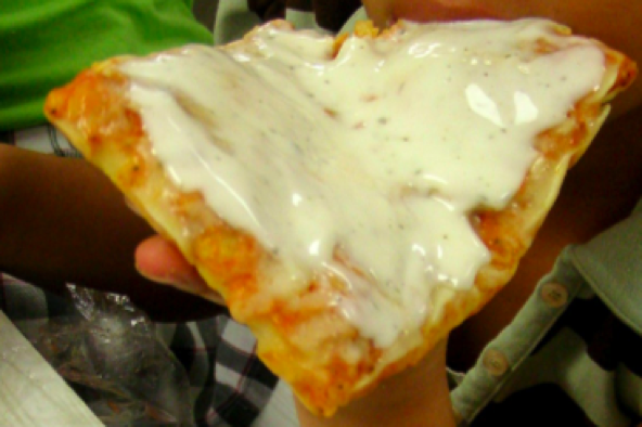 Pizza covered in ranch dressing