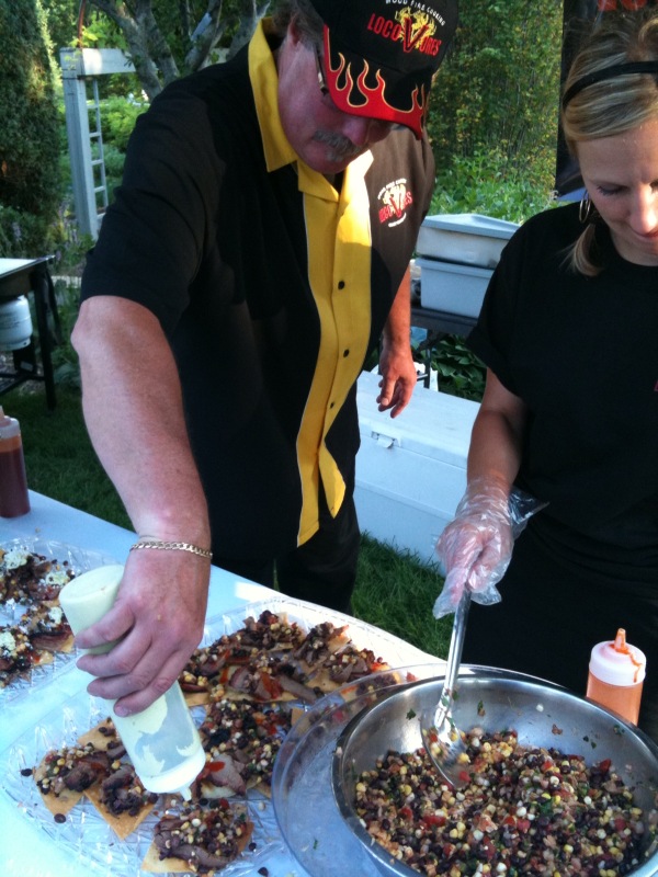 Jim Kyndberg prepares food for LocoVore Barbecue